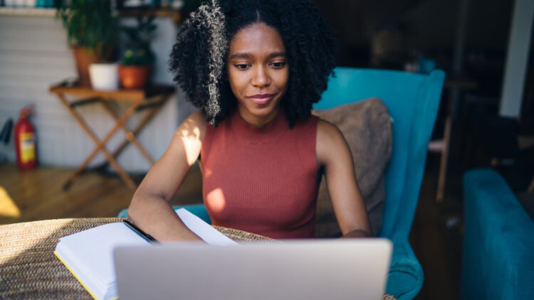 female content writer on her laptop