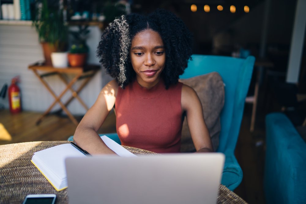 female content writer on her laptop